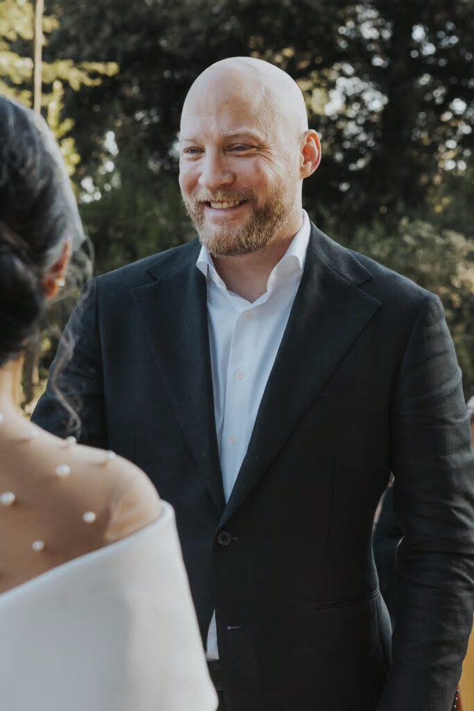 the groom is smiling during an elopement in Rome moment