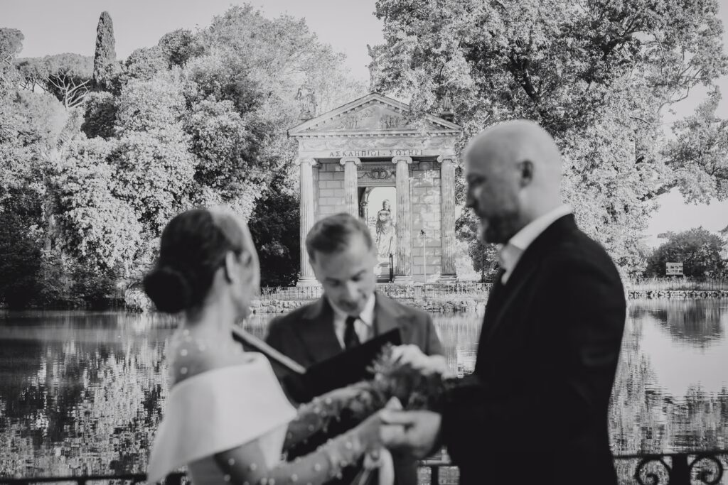 A celebrant is getting married a couple during an elopement in Rome session